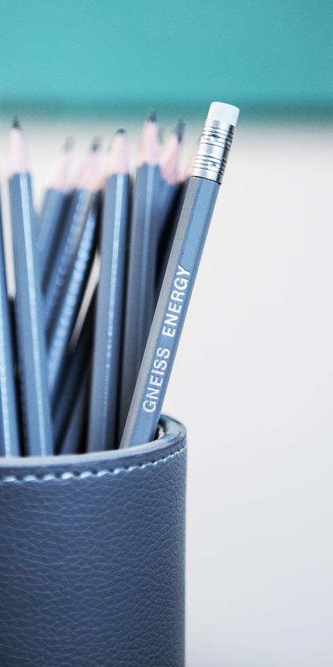 A close up photograph showing stationary in Gneiss Energy's office.