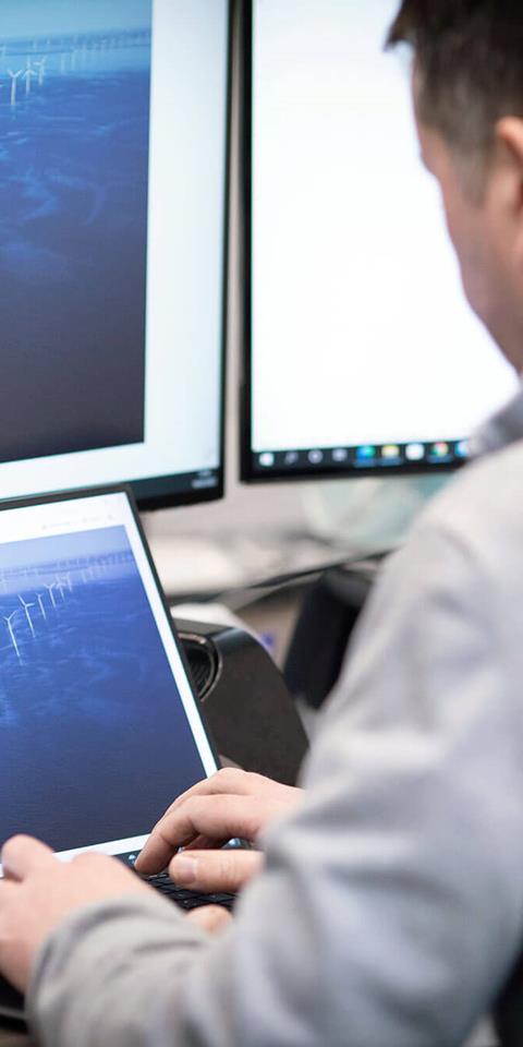 A staff member working at Gneiss Energy's office.