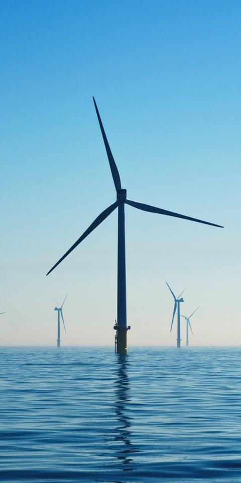 offshore windfarm turbines on a calm sea
